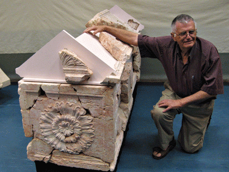 Ehud Netzer by King Herod's lavishly decorated sarcophagus