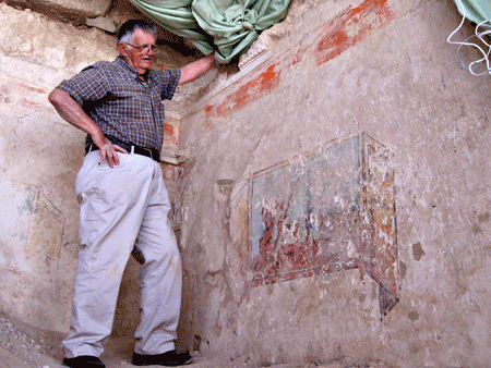 Ehud Netzer revealing colorful wall painting at Herodion's theater