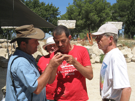 Dr. Oded LIpschits deciphering a stamp impression