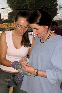 Inspecting a jar handle at Tel Ramat Rahel