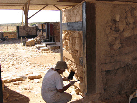 Antiquities conservationist Orna Cohen restoring the ancient entrance to the Canaanite temple