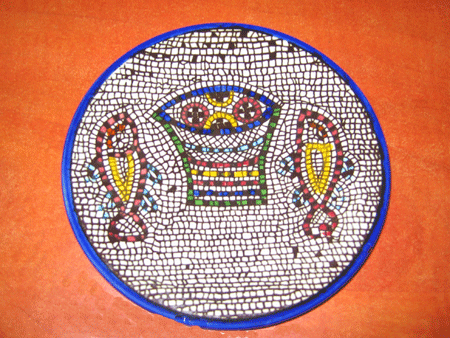 Fish and loaves mosaic copied onto a souvenir plate