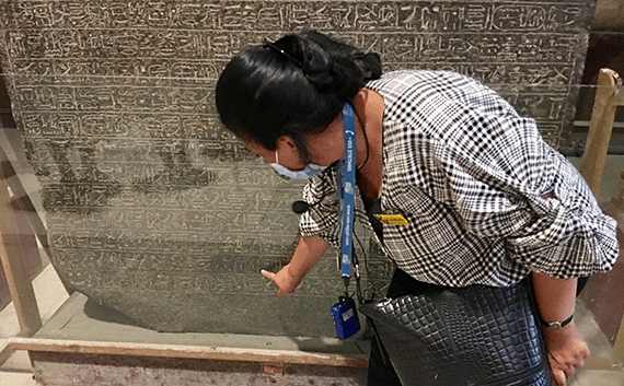 Egyptologist guide pointing out Israel on the Merneptah Stele in Cairo